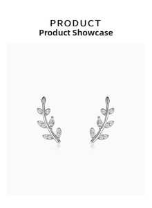 Macro detail of S925 silver leaf earrings with shimmering cubic zirconia settings