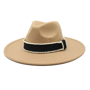 Detail of camel wool fedora hat featuring a black band with white pearl bead accents
