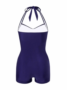Navy blue halter neck romper swimsuit featuring a decorative back bow tie detail