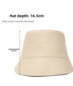 Detail showing the 16.5cm deep bucket hat design in beige PU leather with stitch detail