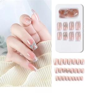 Detailed set of 24pcs pink gradient press-on nails with silver glitter and 3D bows