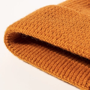 Winter unisex ginger yellow knit beanie hat with thick ribbed cuff and warm texture
