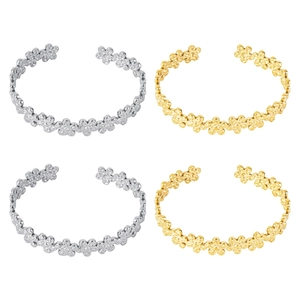 Set of four adjustable flower pattern cuff bracelets in polished gold and silver finishes
