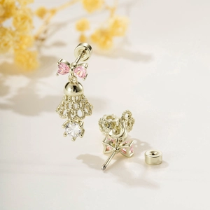 Pink bow bell earrings with white round gems and golden screw back cartilage studs