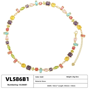 Detailed macro view of colorful zircon stones set in a gold-plated brass necklace