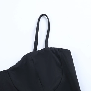 Detail of adjustable thin shoulder straps with metal buckles on a black lace dress