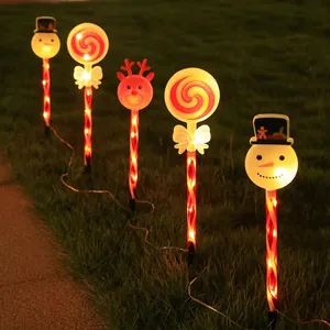 Solar Christmas path lights with snowman reindeer and candy cane shapes for garden lawn decor