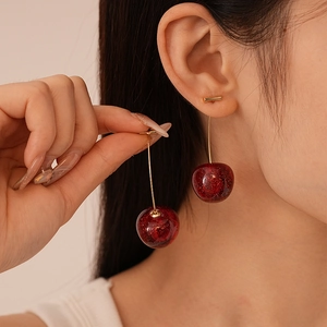 Red resin cherry drop earrings with sparkling glitter finish and golden metal studs
