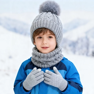 Close-up of baby gray cable knit beanie with faux fur pom and matching scarf