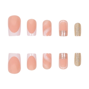 French tip press-on nails with nude marble texture and champagne gold glitter accents