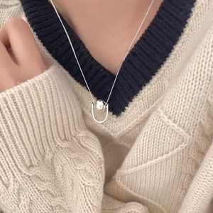 Detail of 925 sterling silver geometric bead pendant on a chic minimalist box chain necklace