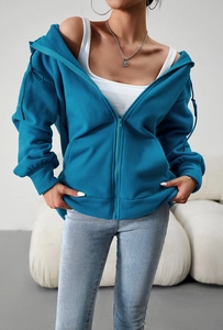 Detailed macro view of the blue fleece hoodie texture and premium zipper fastening