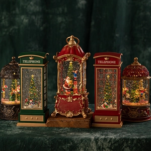 Vintage Christmas lantern music box with Santa figurines and sparkling glitter inside