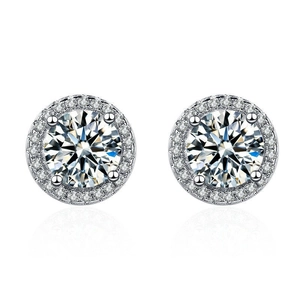 Detailed view of silver stud earrings with round main stone and pave-set zircons on white