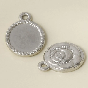 Macro shot of 304 stainless steel silver rose relief pendant and round textured border bezel