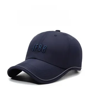 Detail of JFBR 3D embroidery on navy blue baseball cap with reflective brim edge