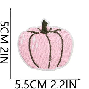 Detail of pink pumpkin embroidery patch with dimensions 5.5cm x 5cm for Halloween