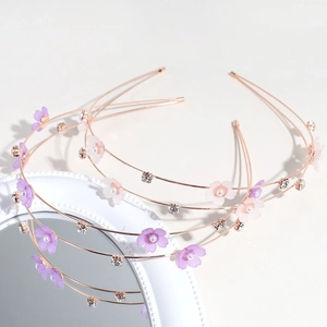 Minimalist double-layer floral headband with pearls and rhinestones on a vintage mirror
