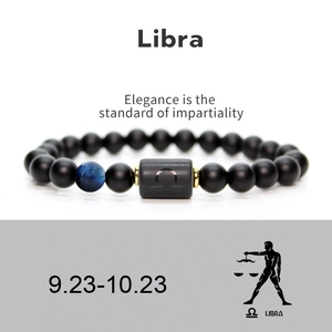 Detail of Libra matte agate beaded bracelet with blue tiger eye stone and gold accents