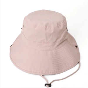 Detail view of pink sun hat with wide brim, reinforced stitching and adjustable wind cord
