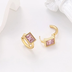 Gold stainless steel hoop earrings with rectangular pink zircon gems on white art background