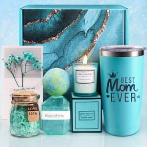 Detail of teal gift box with Best Mom Ever tumbler and handmade scented candle set