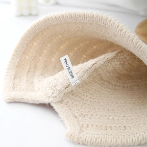 Creamy white knitted bucket hat for women with thick warm wool and soft texture