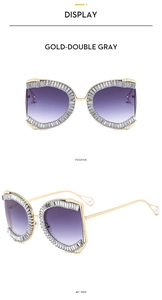 Detail of luxury oversized gold metal sunglasses with crystal-embellished frames