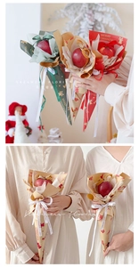 Detail of Christmas kraft paper gift wrap with bell and tree patterns for flower bouquets