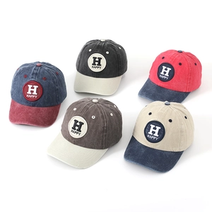 Detailed group view of colorful washed cotton kids baseball caps with Happy embroidery