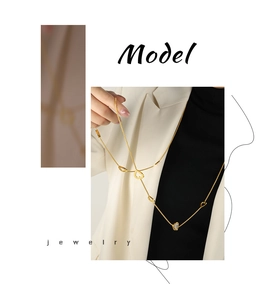 Detail of a 18k gold plated hollow heart necklace with zircon inlay on box chain