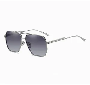 Detail showing silver metal double-bridge aviator frames with grey gradient lenses