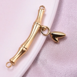 Detail of 18k gold plated stainless steel bamboo T-bar clasp with heart pendant