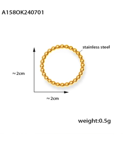 Detail view of gold-plated stainless steel beaded ring with size and weight specs