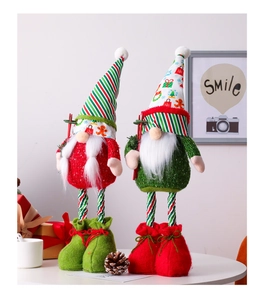 Detail of blue sequin Christmas gnomes with retractable legs for holiday decor