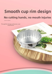 Aluminum foil baking cups with transparent dome lids on a wooden tray for desserts