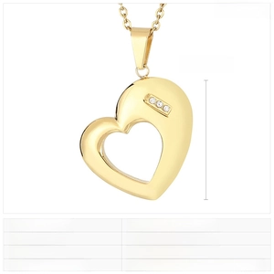 Detail of a gold stainless steel heart pendant with three rhinestones and dimensions 30x24mm