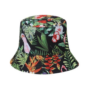 Detail of tropical rainforest print with hibiscus and parrots on a black sun hat