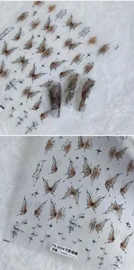 Close-up of TS-3554 embossed nail art stickers with ink butterfly and bamboo patterns