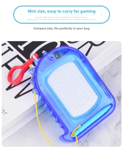 Mini magnetic drawing board with blue shell, yellow stylus and hook for kids on marble desk
