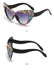 Close-up of cat eye sunglasses with colorful sugar-like grain texture and side view details
