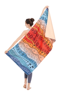 Detail of vibrant microfiber beach towel with mandala patterns and llama silhouettes