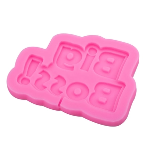 Pink silicone mold with Big Boss lettering for chocolate, fondant, and clay crafts
