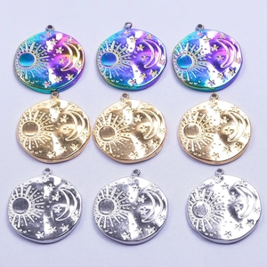 Detail of round sun moon star stainless steel charms in rainbow gold and silver finishes