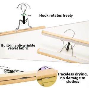 Detail of solid wood hanger showing 360-degree swivel hook and anti-slip flocking lining