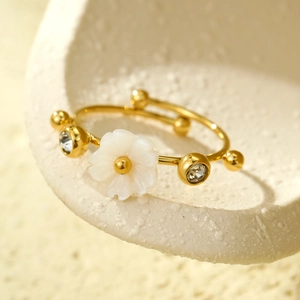 Elegant 18K gold titanium steel flower ring with white shell and zircon accents for women