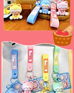 Détail de porte-clés chat floqués colorés avec des dragonnes Little Monster.