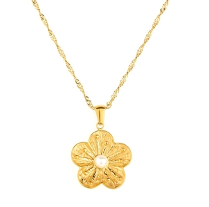Elegant gold flower pendant necklace with white bead on a twisted rope chain