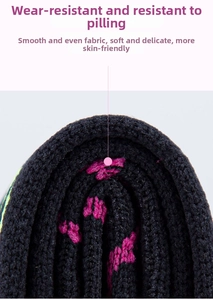 Detailed macro view of black compression socks with pink floral texture and soft fabric