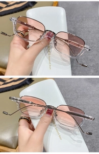 Detail of transparent frame pink lenses and unique wavy metal temples on fashion eyewear